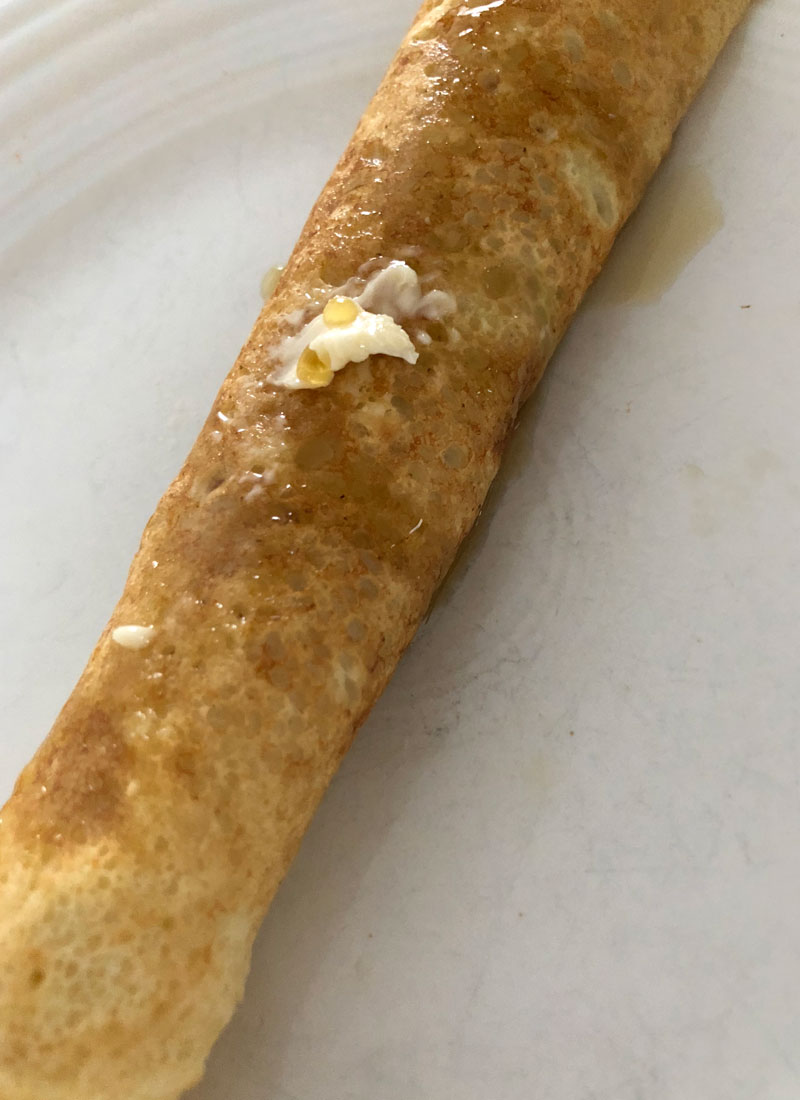 swedish pancake rolled up on a plate